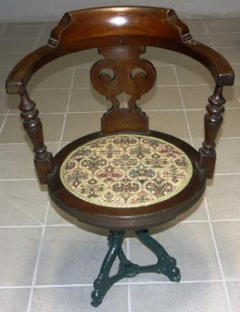 Swivel-chair in mahogany with cast-metal base, ca 1900.